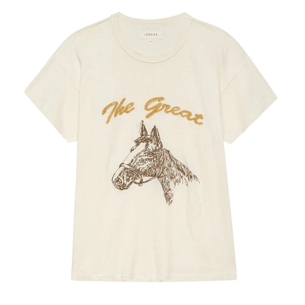 THE GREAT. Cream Short Sleeve Tee with Gold Script and Brown Horse Print